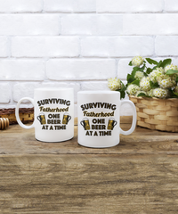 Load image into Gallery viewer, Surviving Fatherhood Funny White Coffee Mug, Father&#39;s Day, Birthday Gifts
